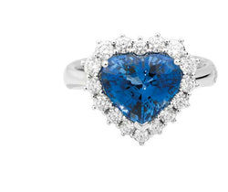 ANNIVERSARY GEMS Ring 18 kt white gold with coloured centre heart-shaped with diamonds brilliant-cut and taper-cut surround Available in Sapphire and Emerald