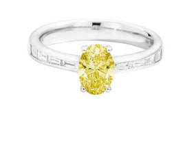 ATELIER Solitaire ring 18 kt white and yellow gold, central yellow fancy oval-cut diamond from 5.00ct (cert. GIA) and taper-cut band 0.29ct