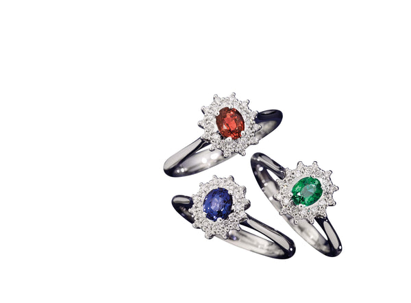 CAMELIA Ring with coloured centre 18 kt white gold,diamonds and oval emerald